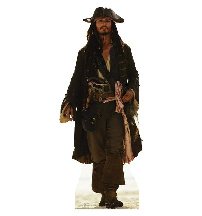 Cardboard cutout of a pirate with long dreadlocks, tricorn hat, and mustache. He wears a tattered black coat, a white shirt, brown trousers, and knee-high boots. A red-striped sash is tied around his waist, and various belts and trinkets adorn his outfit. He walks forward confidently against a white background.
