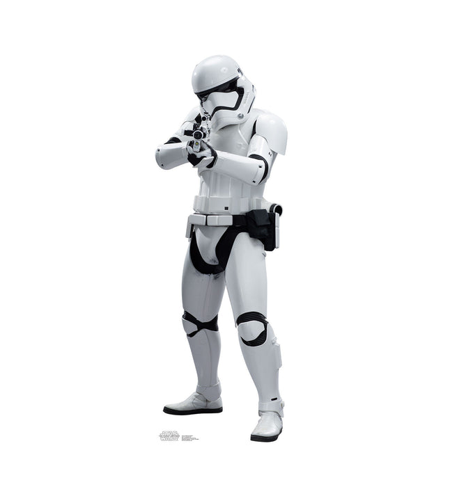 Cutout standee of a Star Wars First Order Stormtrooper in white armor with black detailing, holding a blaster in a ready position.