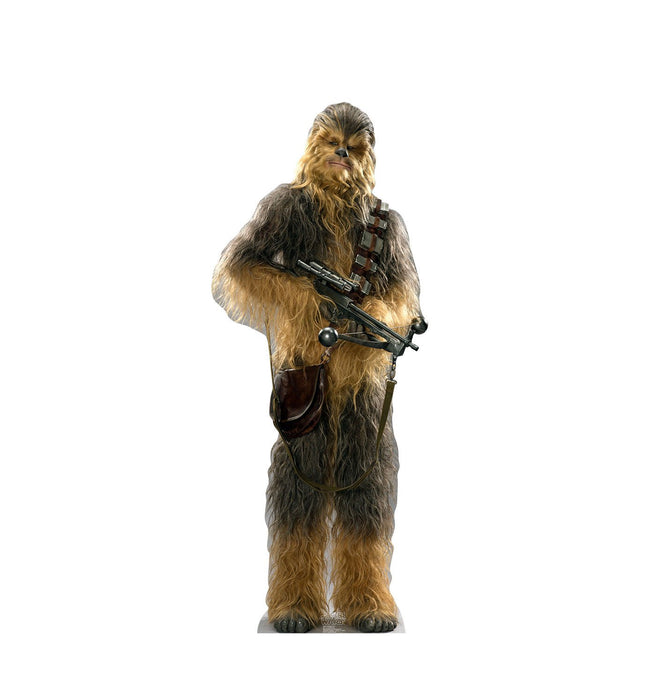 Cutout standee of Chewbacca from Star Wars, depicted as a tall Wookiee with brown fur, wearing a bandolier and carrying a bowcaster.