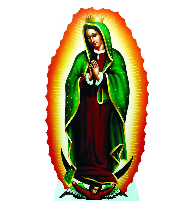 Life-size cutout of Our Lady of Guadalupe. The Virgin Mary is depicted with a green cloak adorned with gold stars, draped over a rose-colored gown. She stands with hands clasped in prayer, surrounded by radiant golden light and an ornate red-orange mandorla. At her feet is a cherub with multicolored wings supporting her with a crescent moon beneath.