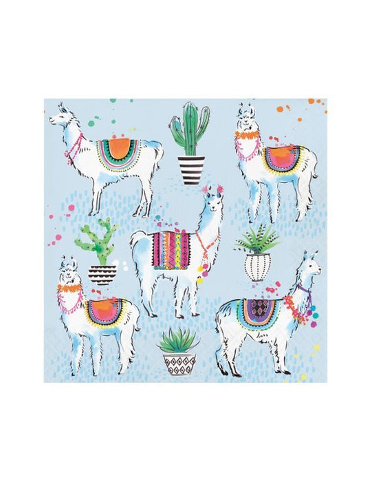A square napkin with a light blue background featuring illustrations of llamas decorated with colorful blankets, surrounded by potted green cacti and succulents with black and white patterned pots. Bright splashes of paint in green, pink, orange, and yellow accent the design.