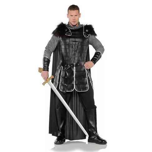 A man wearing a dramatic dark warlock costume featuring a long black robe, mystical silver embellishments, and a hooded cloak, giving the appearance of a powerful arcane sorcerer