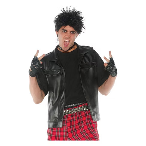 Man wearing black faux leather rocker vest with fingerless gloves, punk accessories, and red plaid pants, posing with rock hand gesture.
