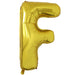 Gold foil balloon shaped like the letter F.