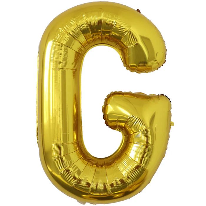 Gold foil balloon shaped like the letter G.