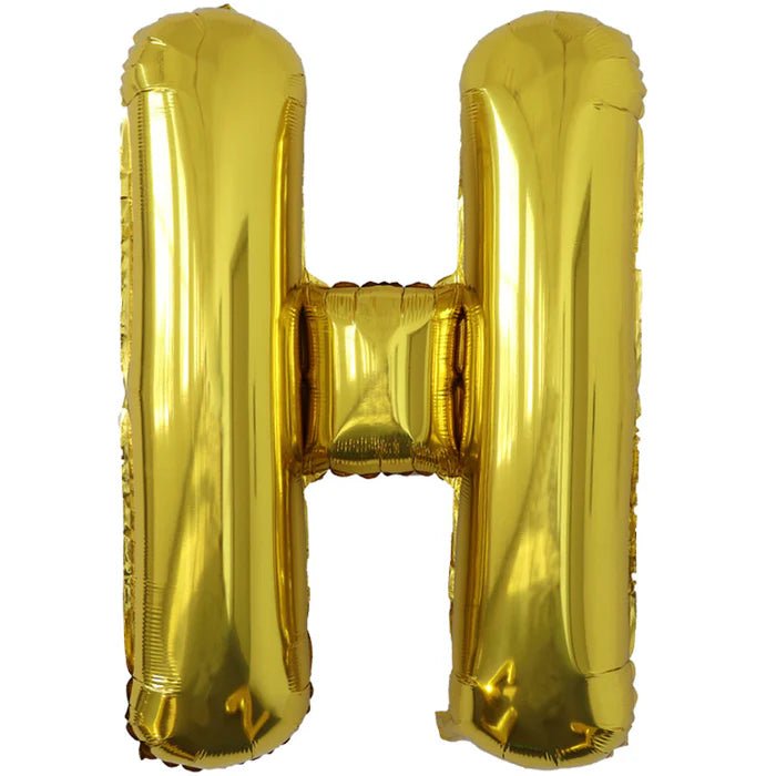 Gold foil balloon shaped like the letter H.