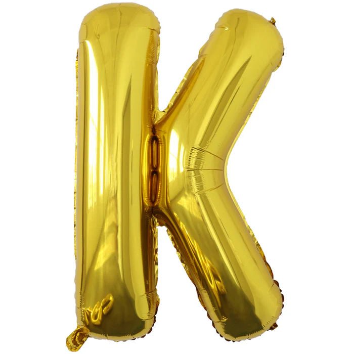 Gold foil balloon shaped like the letter K.