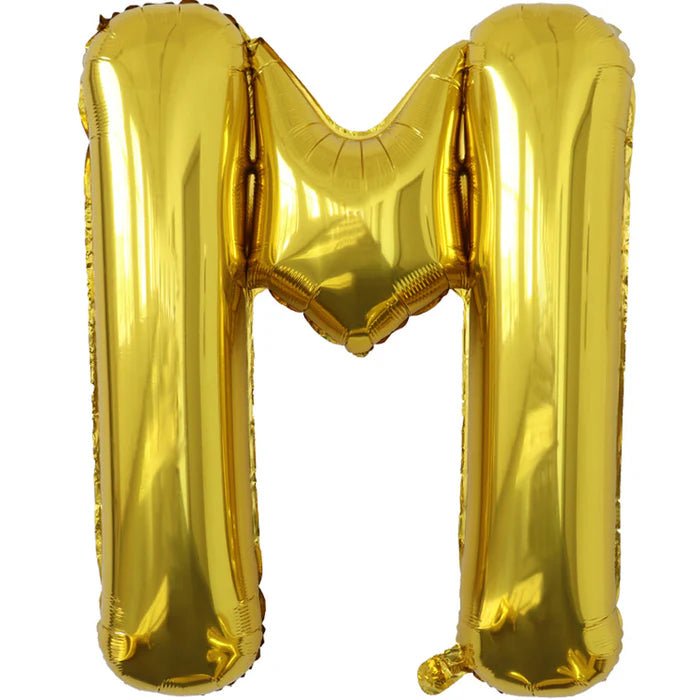 Gold foil balloon shaped like the letter M.