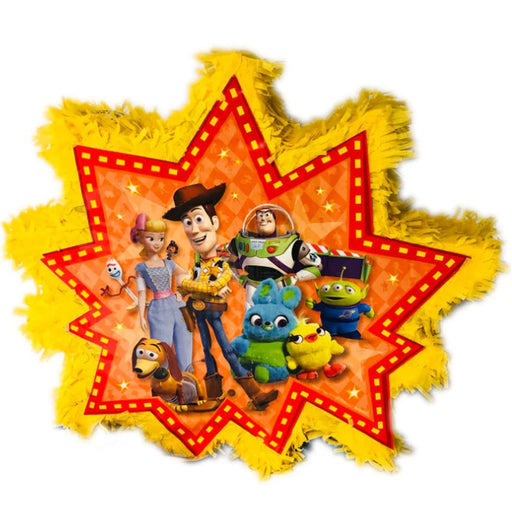 Toy Story-themed piñata in a starburst shape with a yellow fringe border. The center features Woody, Bo Peep, Buzz Lightyear, Forky, Slinky Dog, Ducky, Bunny, and an Alien against an orange patterned background.