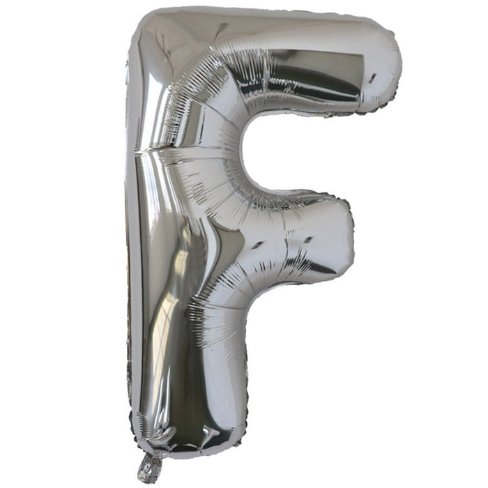 Silver foil balloon shaped like the letter F.