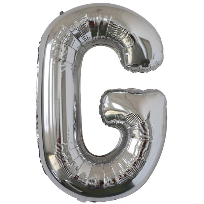 Silver foil balloon shaped like the letter G.
