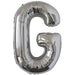Silver foil balloon shaped like the letter G.
