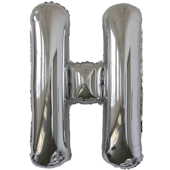 Silver foil balloon shaped like the letter H.