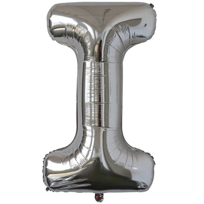 Silver foil balloon shaped like the letter I.