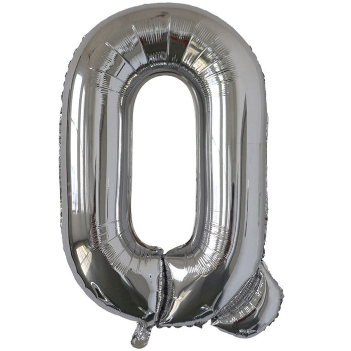 Silver foil balloon shaped like the letter Q.