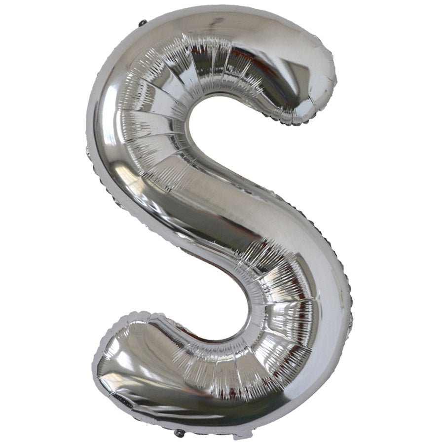 Silver foil balloon shaped like the letter S.