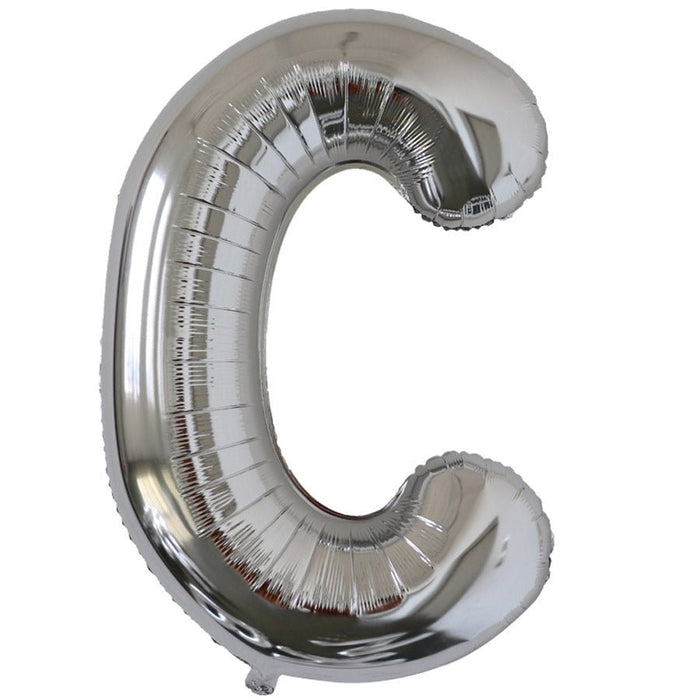 Silver foil balloon shaped like the letter C.