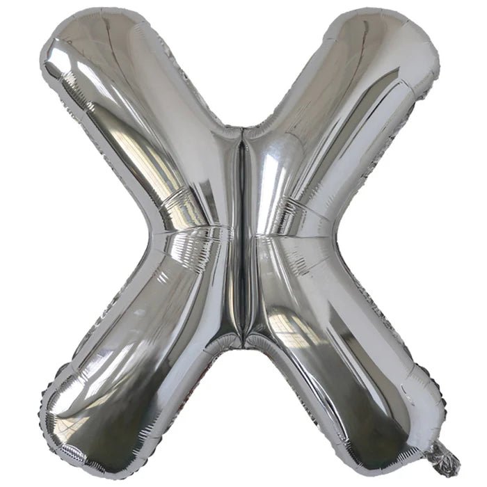 Silver foil balloon shaped like the letter X.