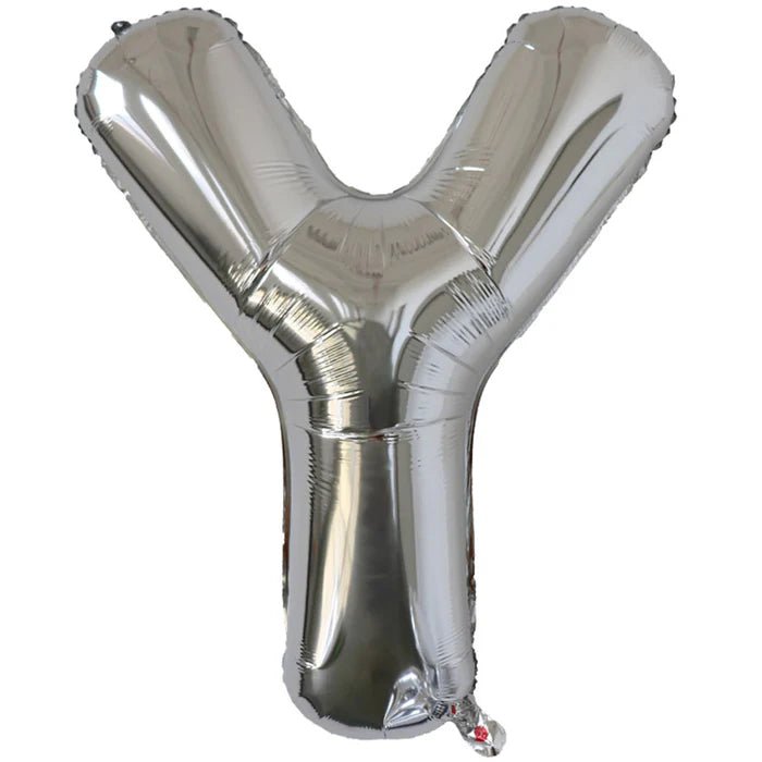Silver foil balloon shaped like the letter Y.
