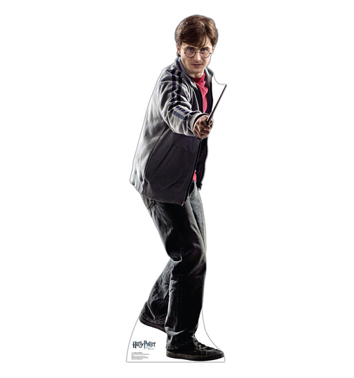 Life-size cardboard cutout of Harry Potter, wearing glasses, a gray jacket over a red shirt, and jeans, holding his wand out in front of him in a defensive stance.