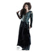 A life-size cutout of a woman with long, wild dark hair wearing a dark green corset-style top and long black skirt, holding a wand in her right hand.