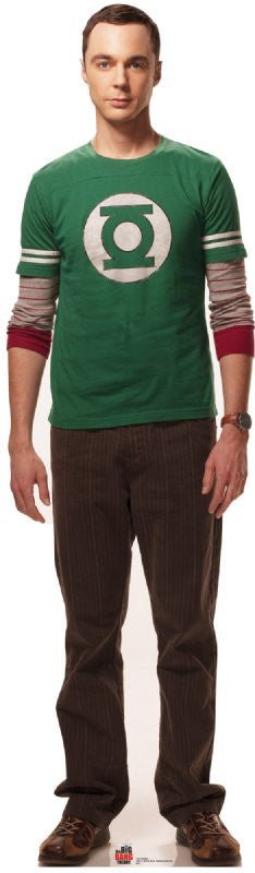 Life-size cardboard cutout of a man with short dark hair wearing a green Green Lantern t-shirt over a long-sleeved striped shirt, brown pants, and brown shoes, standing with arms relaxed by his sides.