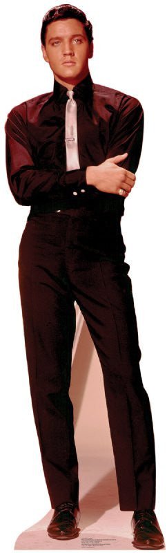 Cutout standee of a man wearing a black long-sleeve shirt, black trousers, and black dress shoes, paired with a shiny silver necktie and matching belt buckle, standing against a light background.