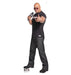 Life-size cardboard cutout of a muscular man wearing sunglasses, a black t-shirt, and dark jeans, holding a WWE microphone and pointing directly forward with a confident expression.