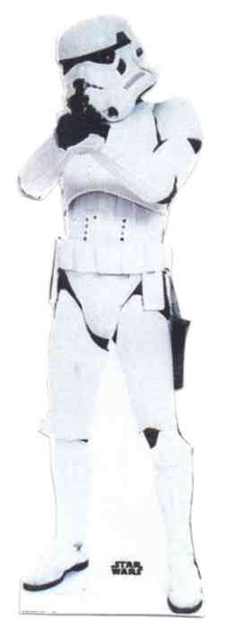 Life-size cutout of a Star Wars stormtrooper in full white armor holding a blaster, standing upright with legs slightly apart and arms raised.