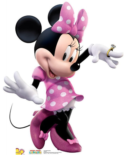 Cardboard cutout of Minnie Mouse wearing a pink dress with white polka dots, matching bow, and pink heels, posed with one foot raised and one hand extended showing a ring.