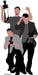 Life-size cardboard cutout illustration of three stylized paparazzi photographers. The figures are in shades of gray, black, and muted peach, each holding a black camera with a flash. One crouches in a light gray jacket, another stands in a dark gray shirt with a black cap, and the third raises his hand in a dark blazer. The overall color scheme is minimalist, using bold contrasts of black and grayscale with skin-toned accents.
