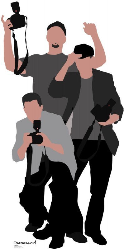 Life-size cardboard cutout illustration of three stylized paparazzi photographers. The figures are in shades of gray, black, and muted peach, each holding a black camera with a flash. One crouches in a light gray jacket, another stands in a dark gray shirt with a black cap, and the third raises his hand in a dark blazer. The overall color scheme is minimalist, using bold contrasts of black and grayscale with skin-toned accents.
