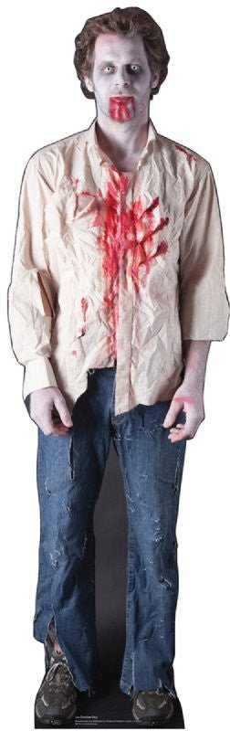Life-size cardboard cutout of a male zombie with pale skin, dark eye circles, and blood dripping from his mouth. He wears a wrinkled, beige button-up shirt heavily stained with blood, distressed blue jeans with tears, and worn-out sneakers. His lifeless stance and expression add to the undead appearance.