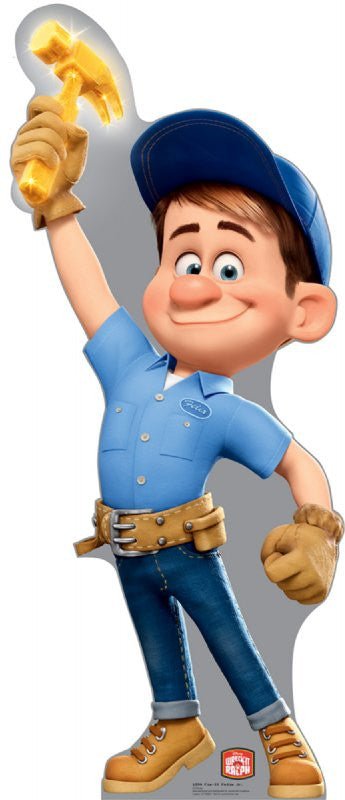 Life-size cardboard cutout of an animated handyman character wearing a blue shirt with a name patch, dark jeans, a blue cap, tan work gloves, and yellow boots. He smiles confidently while holding a glowing golden hammer triumphantly in the air. A tool belt is strapped around his waist. The 'Wreck-It Ralph' logo appears at the bottom.
