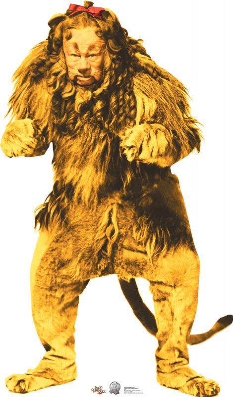 Cowardly Lion character in a full golden-yellow fur costume with a thick, darker brown mane and a red bow tied atop his head. The suit includes a long tail and paw-like gloves and slippers, giving him a soft, animalistic appearance.