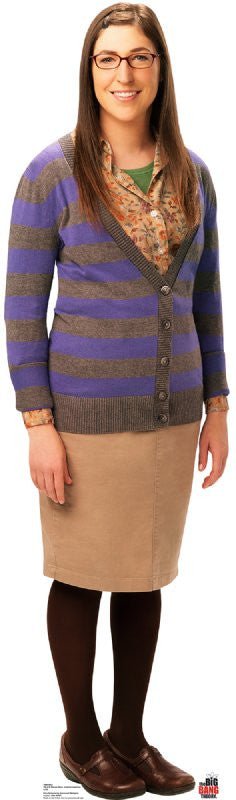 Woman with long brown hair wearing glasses, a purple and gray striped cardigan, floral blouse, tan skirt, dark tights, and brown loafers.