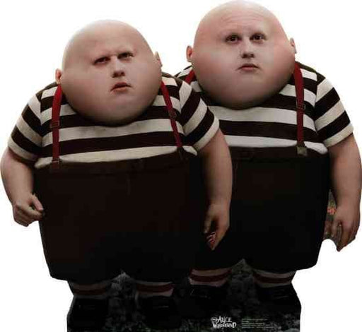 Cardboard cutout of Tweedledee and Tweedledum characters from Alice in Wonderland, wearing black shorts, striped shirts, and red suspenders.