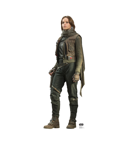 Life-size cardboard cutout of a character from Star Wars, dressed in dark tactical clothing with gloves and boots, standing upright with a confident expression.