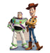 A life-size cutout of Buzz Lightyear in a white and green space suit standing next to Woody, who is wearing a cowboy hat, yellow plaid shirt, blue jeans, and brown boots.