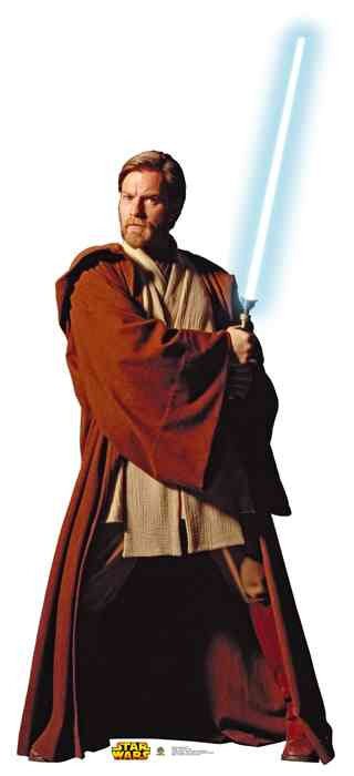 Cardboard cutout of Obi-Wan Kenobi from Star Wars, dressed in a brown Jedi robe over a beige tunic and pants. He is holding a glowing blue lightsaber in both hands, posed in a defensive stance. The Star Wars logo appears at the base.
