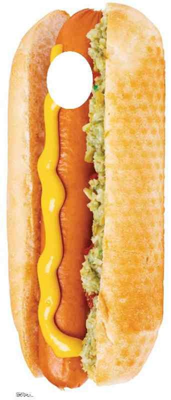 Cut-out of a hot dog in a bun with a squiggly line of yellow mustard on the sausage and a generous portion of chopped relish on one side. The bun is golden brown and a circular hole is cut out from the top portion, suggesting use as a novelty costume or photo prop.