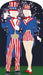 A faceless man and woman in red, white, and blue patriotic outfits with stars and stripes, standing in front of fireworks; the man wears a top hat and long coat, the woman wears a short romper and red heels.