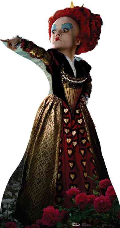 A woman with bright red hair styled high, wearing a gold, black, and red gown with heart patterns and dramatic blue eyeshadow, pointing with an outstretched arm.