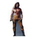 A life-size cutout of a muscular shirtless man with long brown hair, wearing tan pants with fringe, black boots, and holding a chain in both hands.