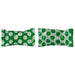Two pieces of green candy with white polka dot wrappers, shown side by side with a gap in the middle where they have been separated.