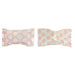 Two pieces of pastel pink candy with white polka dot wrappers, shown side by side with a gap in the middle where they have been separated.