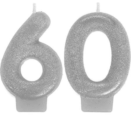 Two silver glitter number candles forming the number 60, each with a small wick at the top.