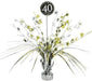 Table centerpiece decoration with metallic silver and gold foil sprays, star accents, and number cutouts, featuring a black circular topper with '40' in white glitter text.