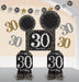 Black, gold, and silver 30th birthday decoration kit with assorted paper cutouts, banners, and table centerpieces featuring the number 30 and 'happy birthday' text in a glittery design.