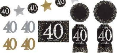 Black, gold, and silver 40th birthday decoration kit with assorted paper cutouts, banners, and table centerpieces featuring the number 40 and 'happy birthday' text in a glittery design.